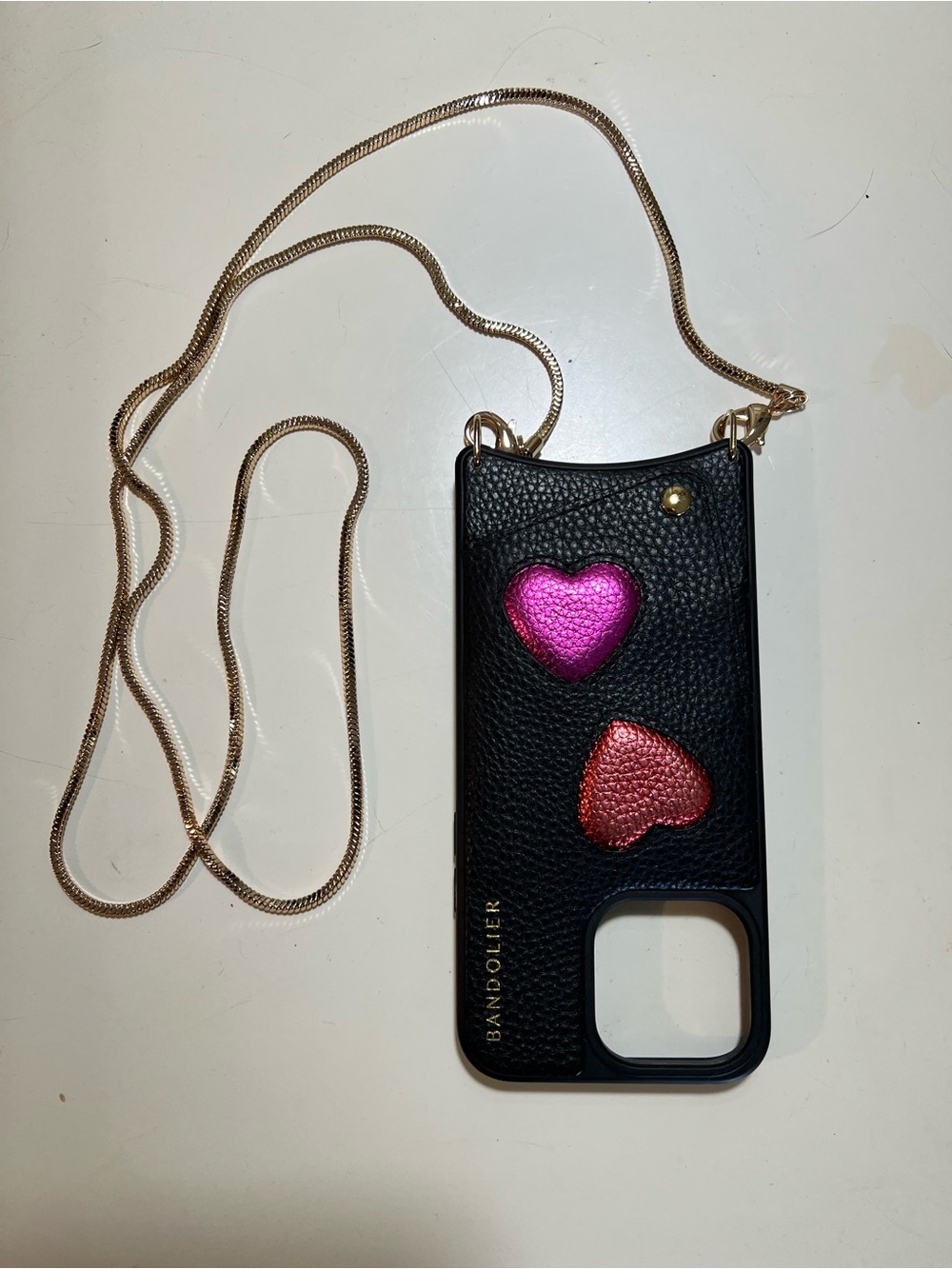 Bandolier Gia Heart crossbody wallet
Case with gold chain strap.